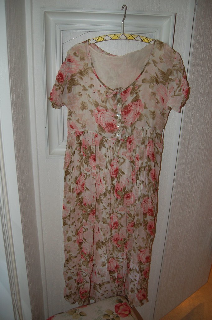 A rosy dress as shabby chic decoration on the wall