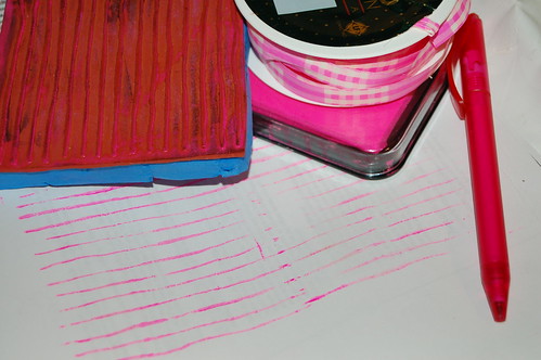 Pink writing lines stamped on a white page n my travel journal by iHanna (Photo copyright Hanna Andersson)