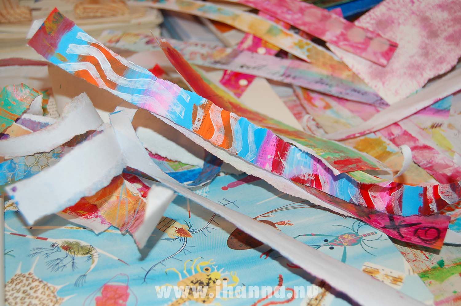 Doing the crusade Strip Ease using strips of painted papers (Copyright Hanna Andersson)