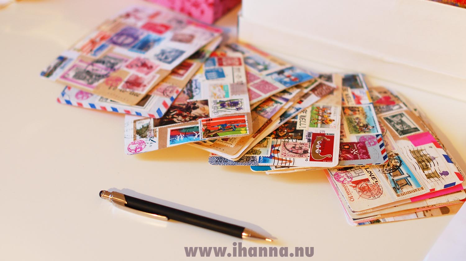 Pile of finished postal stamp DIY Postcards by iHanna (Copyright Hanna Andersson)