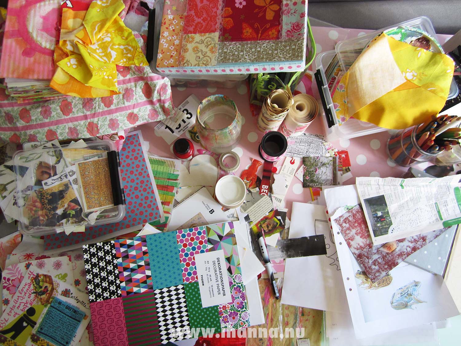 The mess on top of my desk filled with ink, pencils, pretty papers, scraps of fabric (Photo copyright Hanna Andersson)