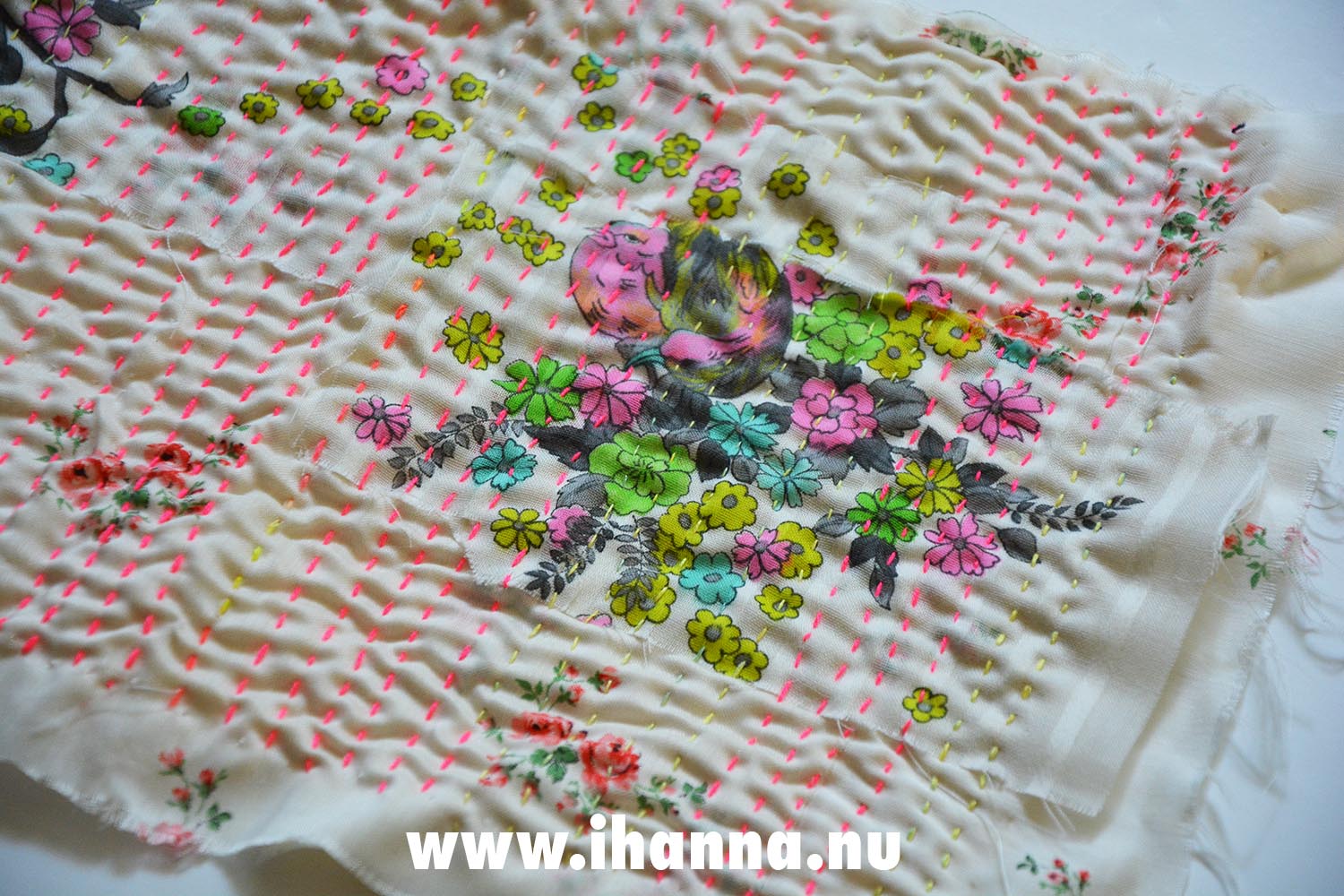 Cloth with neon pink and yellow running stitches  (Copyright Hanna Andersson)