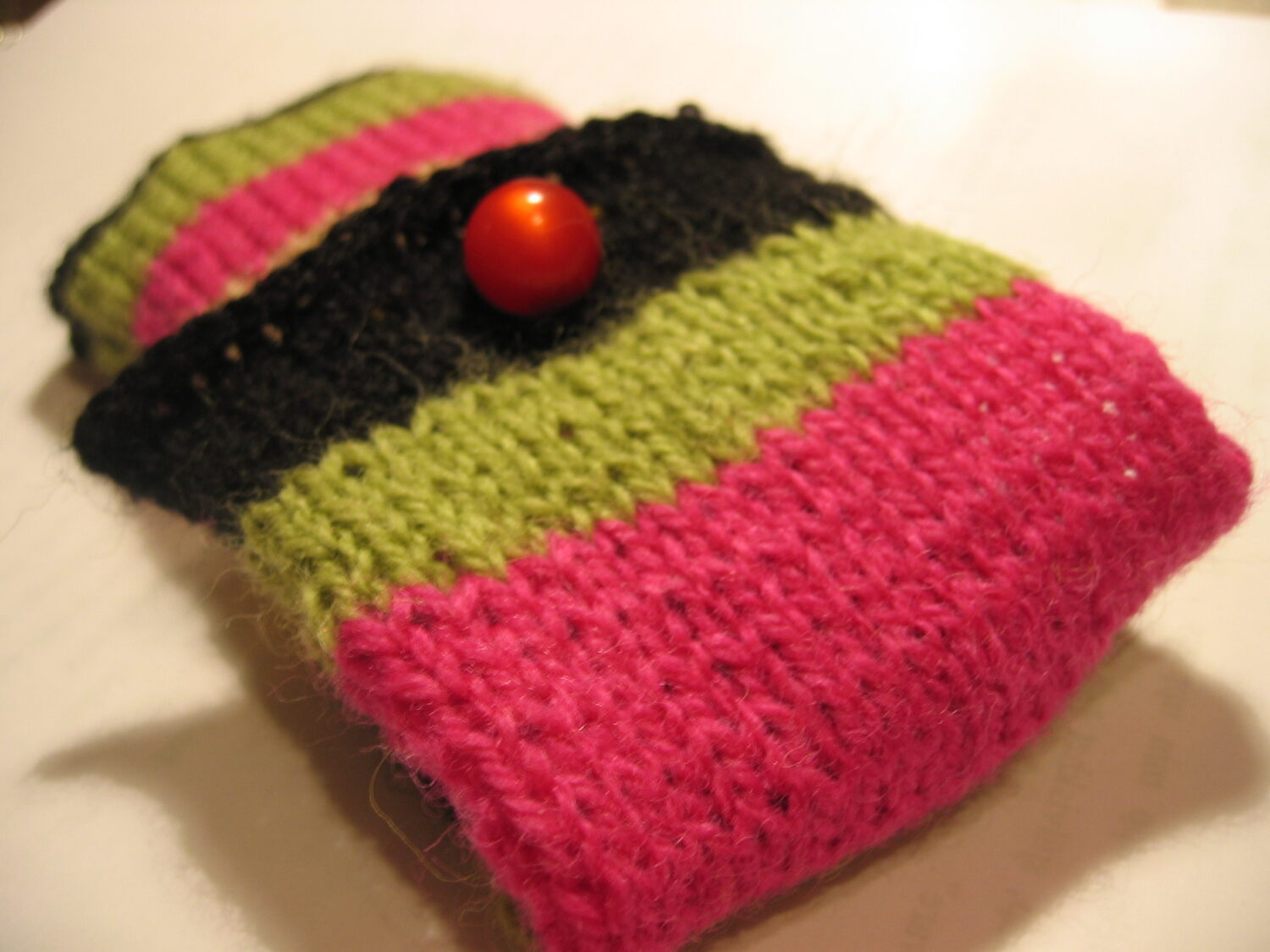 Striped knitted cell phone cozy by iHanna (Copyright Hanna Andersson)