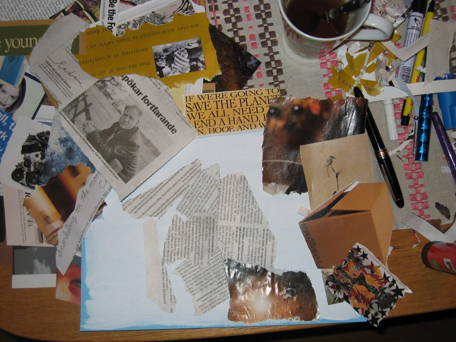 All you need is a friend, some tea and a few magazines to cut up on your messy table (Photo copyright Hanna Andersson)