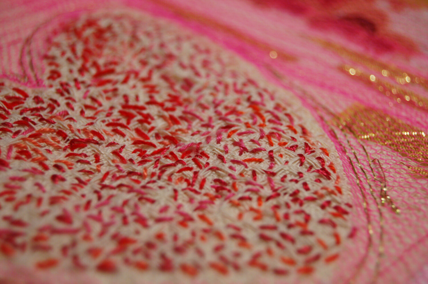 Close up detail of the art quilt Pink Sweet Heart Embroidery textile art piece with many many stitches by iHanna (Copyright Hanna Andersson)