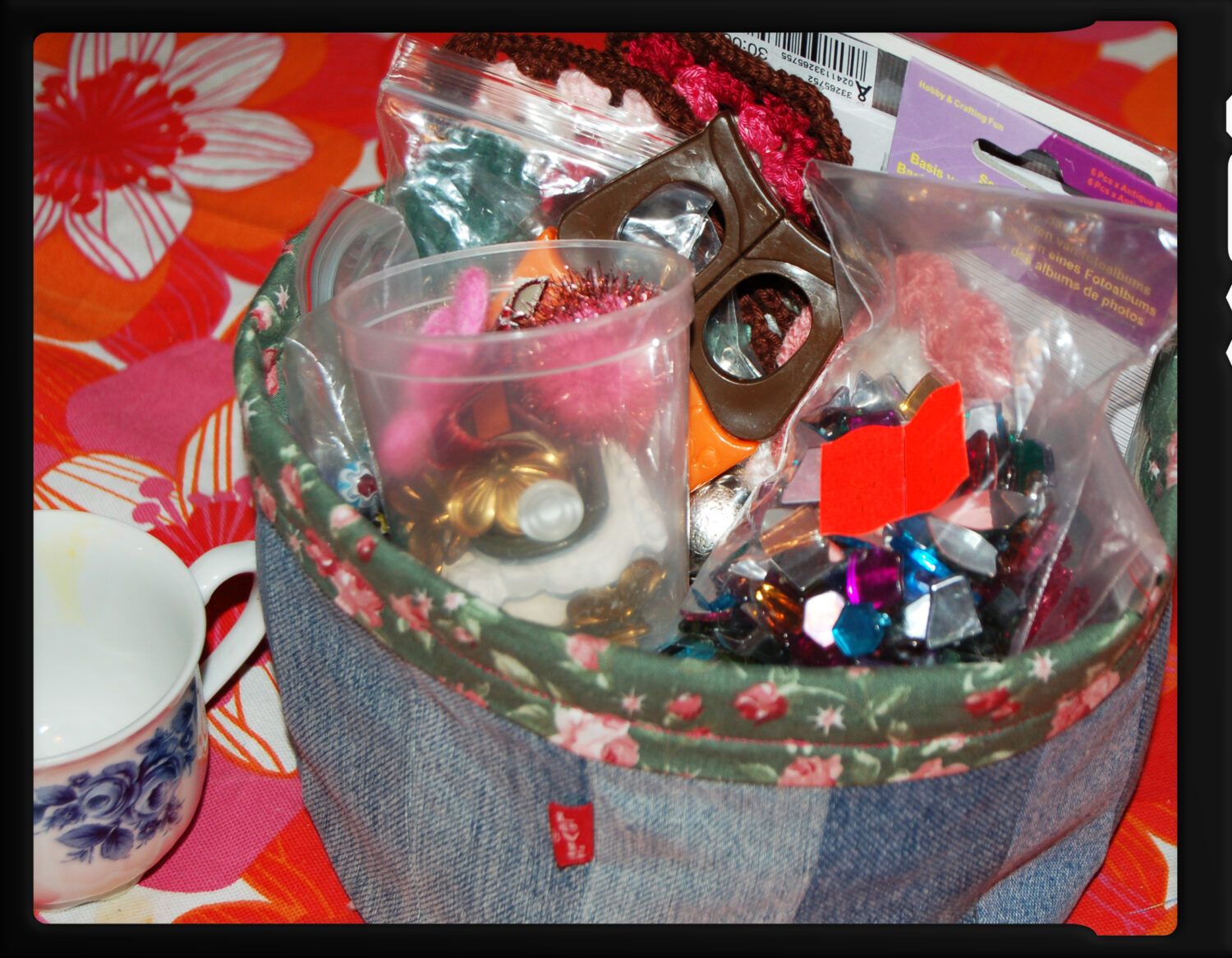 DIY Denim basket stuffed full of beads and craft supplies to play with (Photo copyright Hanna Andersson) 2008