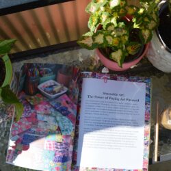 Reading the book Share Your Joy by Sarah Gardner on my balcony this summer (Photo copyright Hanna Andersson)